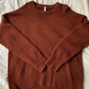 The Group Babaton womens dark orange long sleeve sweater.